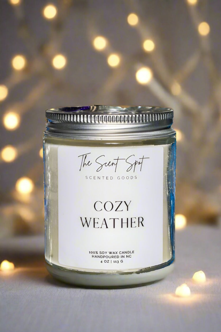 The Scent Spot Cozy Weather CandleCandleThis soy candle brings the outdoors inside with its fresh, uplifting scent. It starts with a cool mix of fresh air and spearmint, making you feel revitalized. Then, Cozy Weather Candle